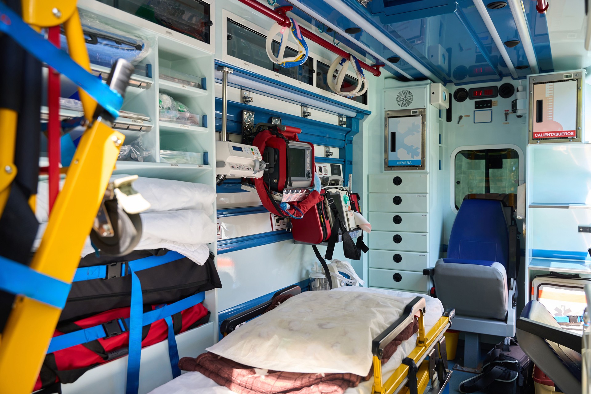 Stretcher and medical tools inside emergency ambulance
